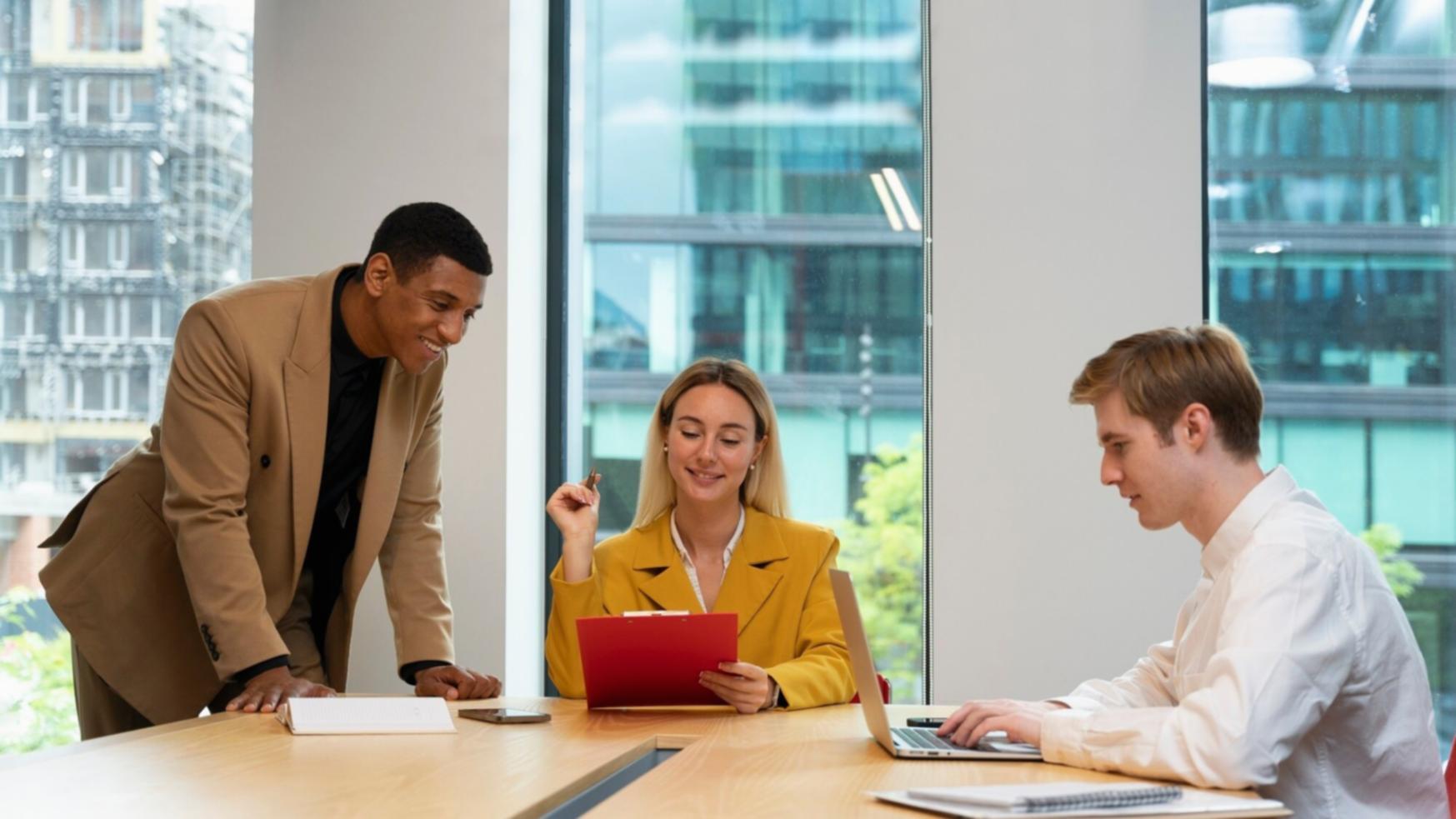 Business professionals collaborating on financial planning strategies in modern office environment